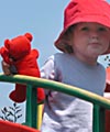 On a secret mission with red teddy and matching hat